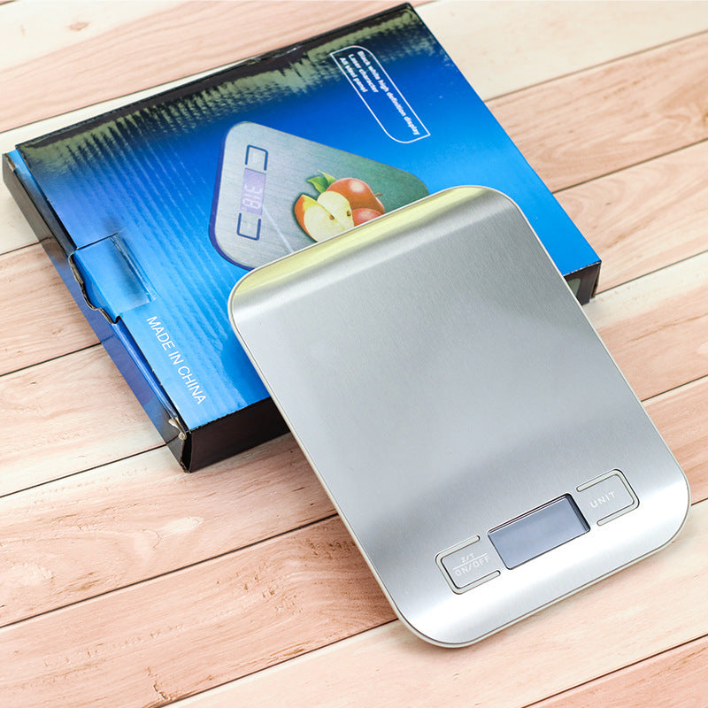 Kitchen Electronic Scale Household Food Baking Gram Measuring on wooden surface with packaging visible.